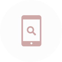 虫眼鏡のアイコンが表示されたスマートフォンの図